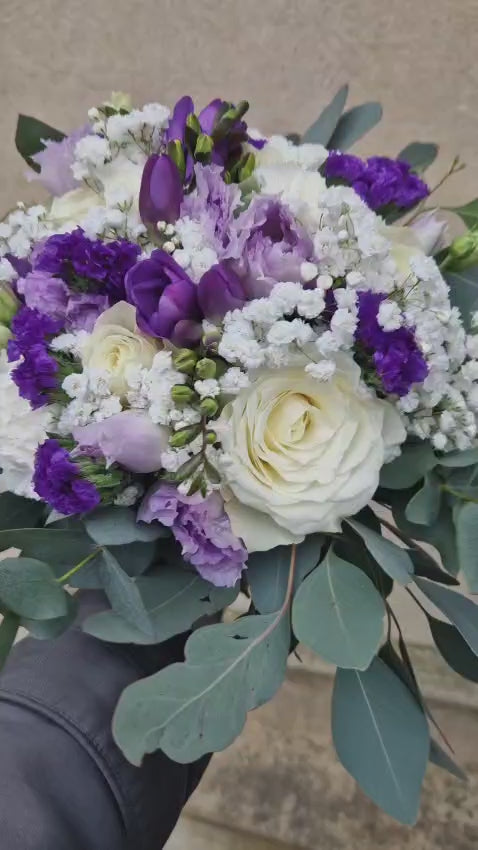 white rose and purple lisianthus wedding bouquet